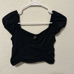 Black cropped off shoulder